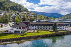 an aerial view of a building next to a river at Stryn Hotel in Stryn