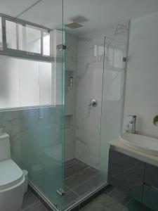 a bathroom with a shower and a toilet and a sink at nuevo amanecer in Bello +13 photos