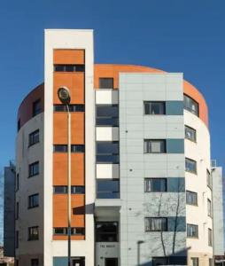 a tall building with a street light in front of it at Casa Kerr @ The Broch in Perth