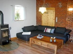 a living room with a couch and a coffee table at die schmiede in Burg auf Fehmarn