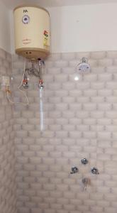 a shower with a plastic wall in a bathroom at CERULEAN RETREAT in Lava