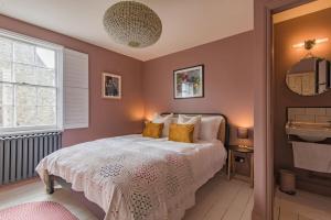 a bedroom with a bed and a window at Rosewood in Walmer