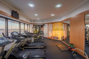 a gym with treadmills and elliptical machines at Central Park Hotel by Bourbon in Cascavel
