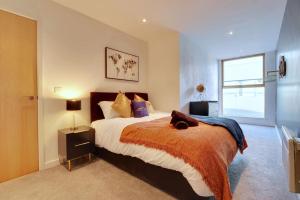 a bedroom with a large bed and a window at Home Away From Home - Contractors & Leisure in Sheffield