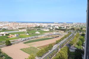 an aerial view of a city with a train at Duplex LOFT Apartamento con Parking GRATIS in Valencia