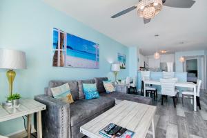 a living room with a couch and a table at Prince Resort Oceanfront 1834 at Cherry Grove Pier in Myrtle Beach