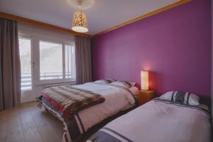 Кровать или кровати в номере In the center of Crans-Montana, charming and comfortable