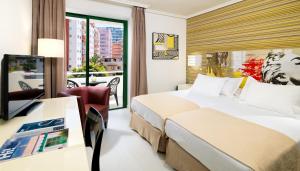 Posteľ alebo postele v izbe v ubytovaní H10 Tenerife Playa