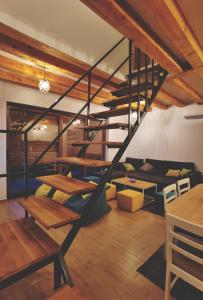 a loft with a spiral staircase in a room at Holiday home D&D in Bosanska Krupa