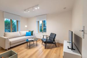 TV a/nebo společenská místnost v ubytování Ostseevilla - Appartement 05