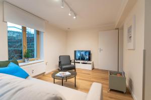 TV a/nebo společenská místnost v ubytování Ostseevilla - Appartement 05