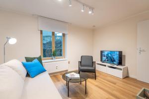 TV a/nebo společenská místnost v ubytování Ostseevilla - Appartement 05