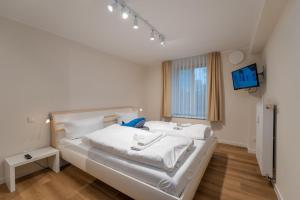 Postel nebo postele na pokoji v ubytování Ostseevilla - Appartement 05