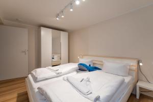Postel nebo postele na pokoji v ubytování Ostseevilla - Appartement 05