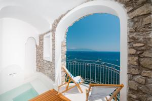 a balcony with a view of the ocean at Hotel Cetus in Cetara