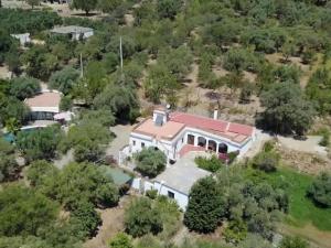 an aerial view of a large house with a red roof at Belvilla by OYO Cortijo de Santa Cruz in Órgiva