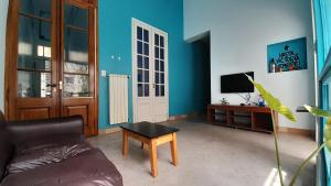 a living room with a couch and a table at Sabatico Suites in Buenos Aires