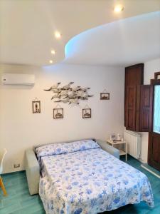 Ένα ή περισσότερα κρεβάτια σε δωμάτιο στο Ondina Blu Gaeta