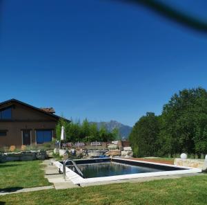 a swimming pool in the yard of a house at Locanda Cà Del Pian in Villanova Mondovì