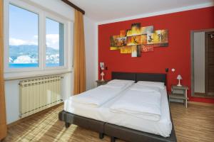 Postel nebo postele na pokoji v ubytování Hotel Garni Ischia
