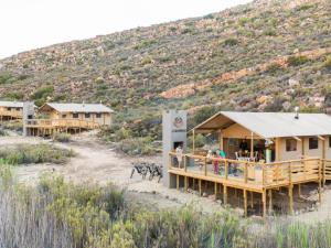 a group of buildings with a mountain in the background at AfriCamps at Karoo 1 in De Doorns