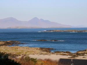 a large body of water with mountains in the background at Borve House, Kilchoan in Kilchoan