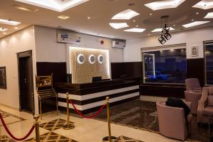 a lobby with a waiting room with black and white stripes at Ahlin Suites 5 in Riyadh