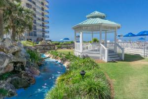 a gazebo next to a river in a park at Edgewater Beach & Golf Resort by Panhandle Getaways in Panama City Beach