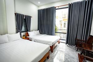 Ένα ή περισσότερα κρεβάτια σε δωμάτιο στο Mini hotel Lạc Hồng