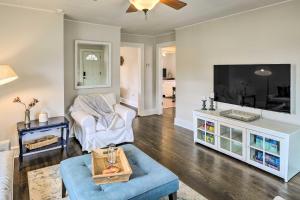 a living room with a couch and a tv at Pet-Friendly Greensboro Vacation Rental! in Greensboro