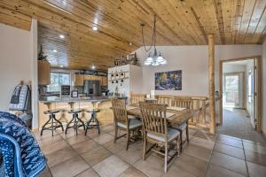 a kitchen and dining room with a wooden ceiling at Woodland Park Home with Stunning Mountain Views in Woodland Park