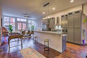a large kitchen with a bar and a dining area at Near Downtown Dayton Historic South Park Home in Dayton