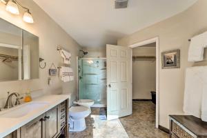 a bathroom with a sink and a toilet and a shower at Cozy Cottage Near Broyhill Walking Park! in Lenoir