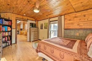 a bedroom with a bed and a wooden ceiling at Cozy Cottage Near Broyhill Walking Park! in Lenoir