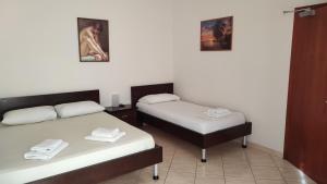 Ένα ή περισσότερα κρεβάτια σε δωμάτιο στο Guesthouse Villa Joanna&Mattheo +51 φωτογραφίες