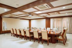 a large conference room with a long table and chairs at Peacock Hotel in Dar es Salaam +88 photos