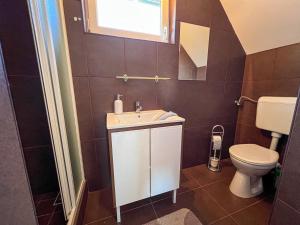Kúpeľňa v ubytovaní SunnySide Apartmanház