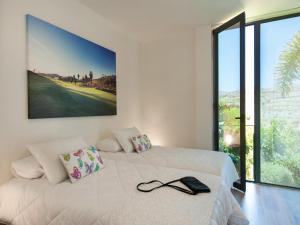 Postel nebo postele na pokoji v ubytování Los Lagos 20 by VillaGranCanaria