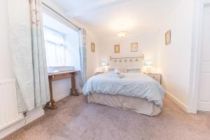 Postel nebo postele na pokoji v ubytování Stables Cottage Far Sawrey Windermere