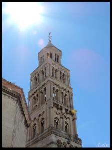 a tower of a building with a cross on it at Apartments Lana in Split