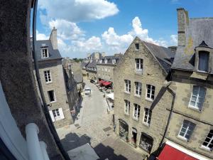 a view of a city street from a window at L'Ecrin de Pauline in Dinan
