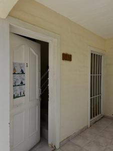 an open door in a room with a staircase at Departamento Kuyen in Las Grutas