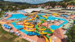a large water park with a water slide at Guesthouse Maya**** in Tuheljske Toplice