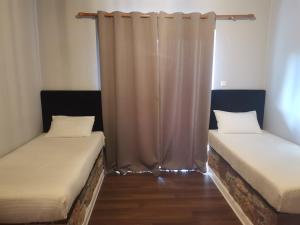 Postel nebo postele na pokoji v ubytování Ataviros Hotel