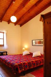 a bedroom with a large bed in a room at Vale do Guizo: Casa Poente on the contryside, close by the sea. in Aljezur