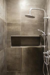 a shower with a sink and a shower head at Nonna Sicula in Agrigento