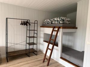 a room with two bunk beds and a bed at Nicas guest house in Liepāja