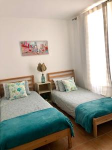 Postel nebo postele na pokoji v ubytování Cotillo Relax
