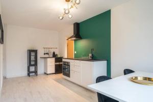 Kuchyňa alebo kuchynka v ubytovaní Appartement Cosy Art Déco/ Proche centre-ville