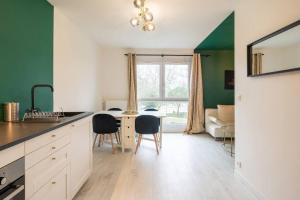 Kuchyňa alebo kuchynka v ubytovaní Appartement Cosy Art Déco/ Proche centre-ville